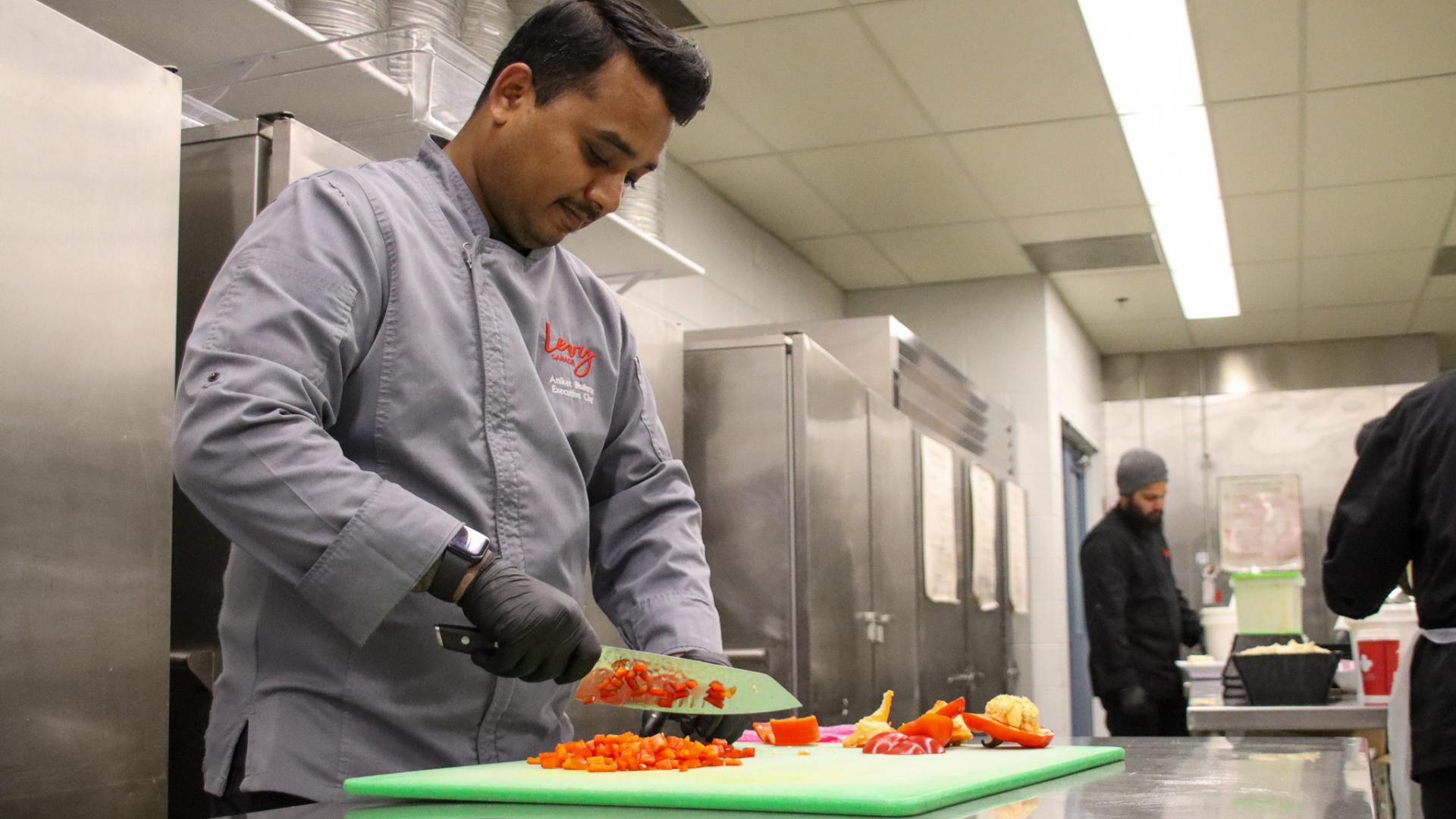 Chef Aniket with Levy Foods cooking in the kitchen