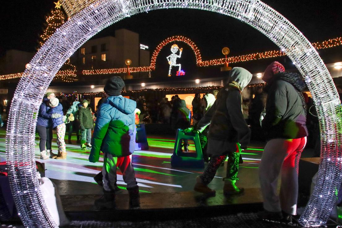 People skate inside the Canada Games Plaza